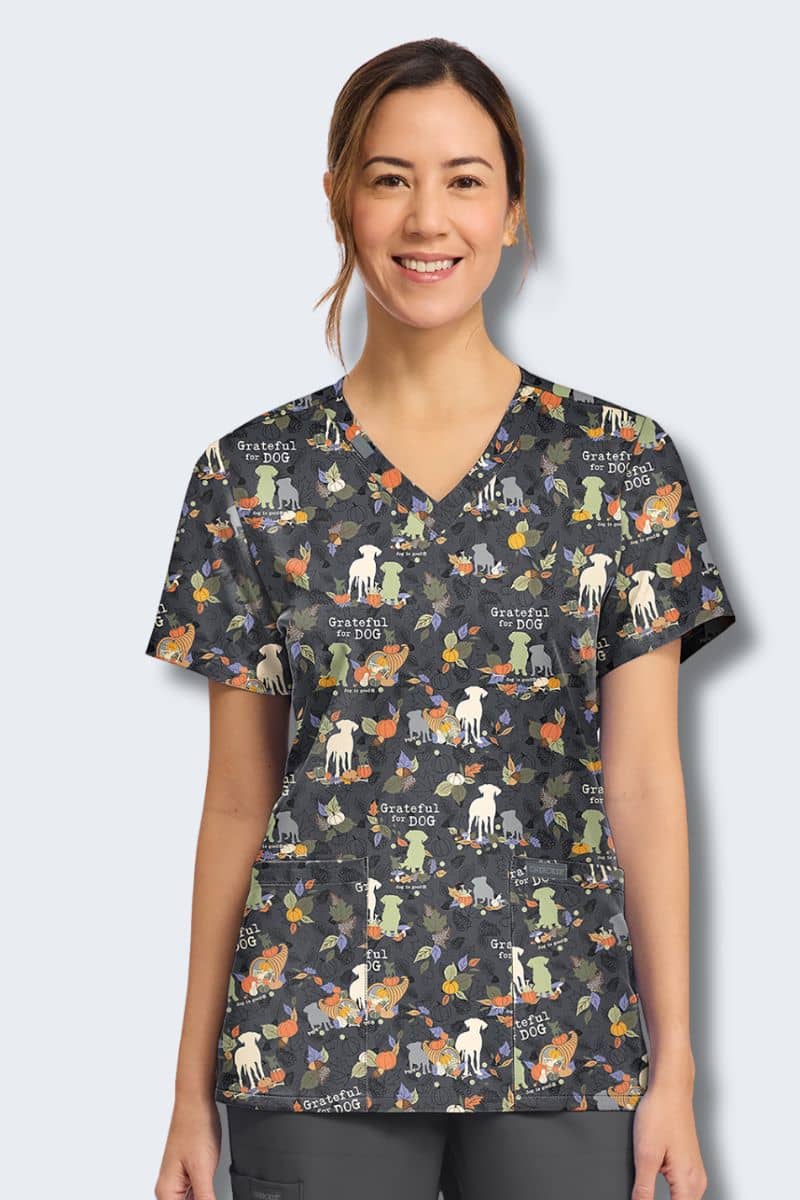 Cherokee CK856 Grateful For Dog print scrub top, front view – autumn leaves, pumpkins and dogs of every shape and size on charcoal grey, Infectious Clothing Company