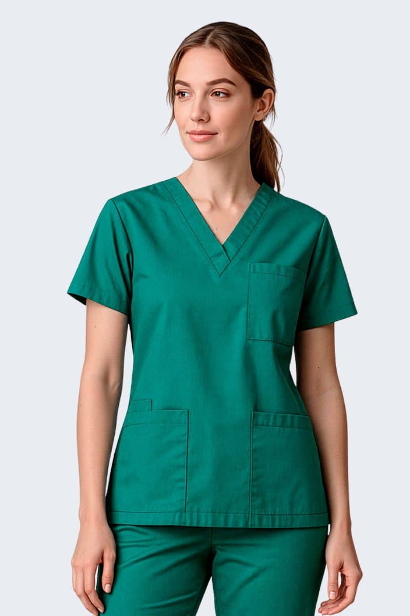 Person wearing a green scrub set on a light gray background