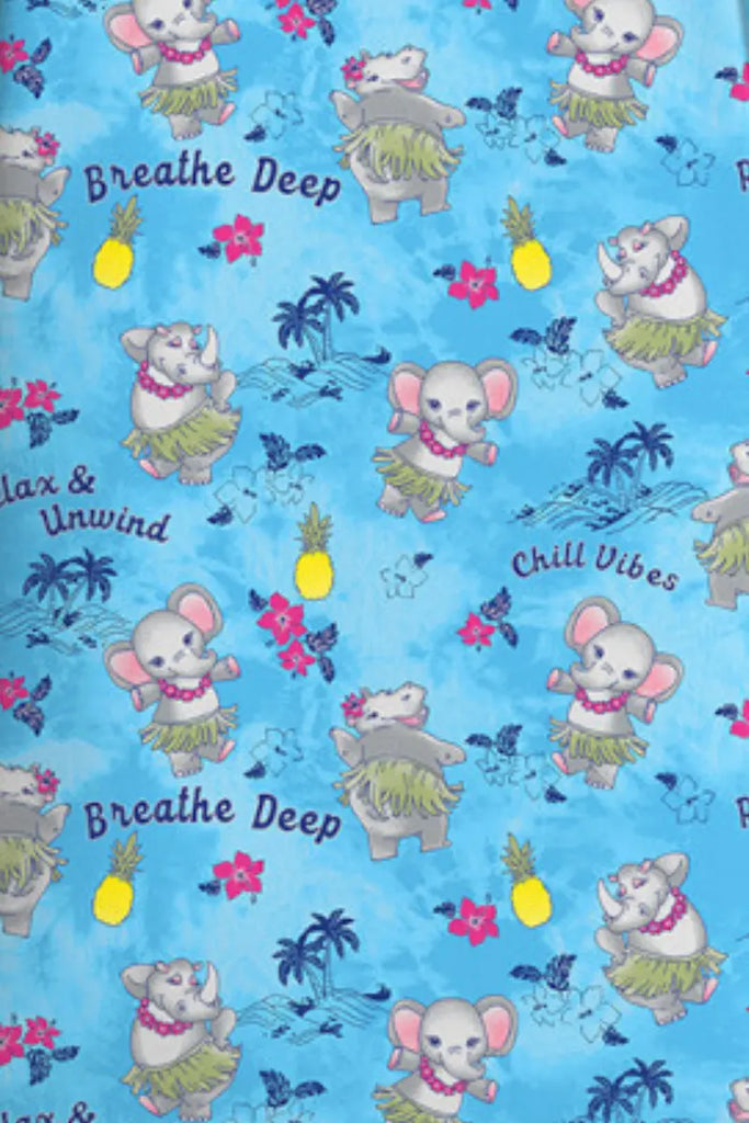 Patterned fabric with cartoon elephants in hula outfits and text on a blue background