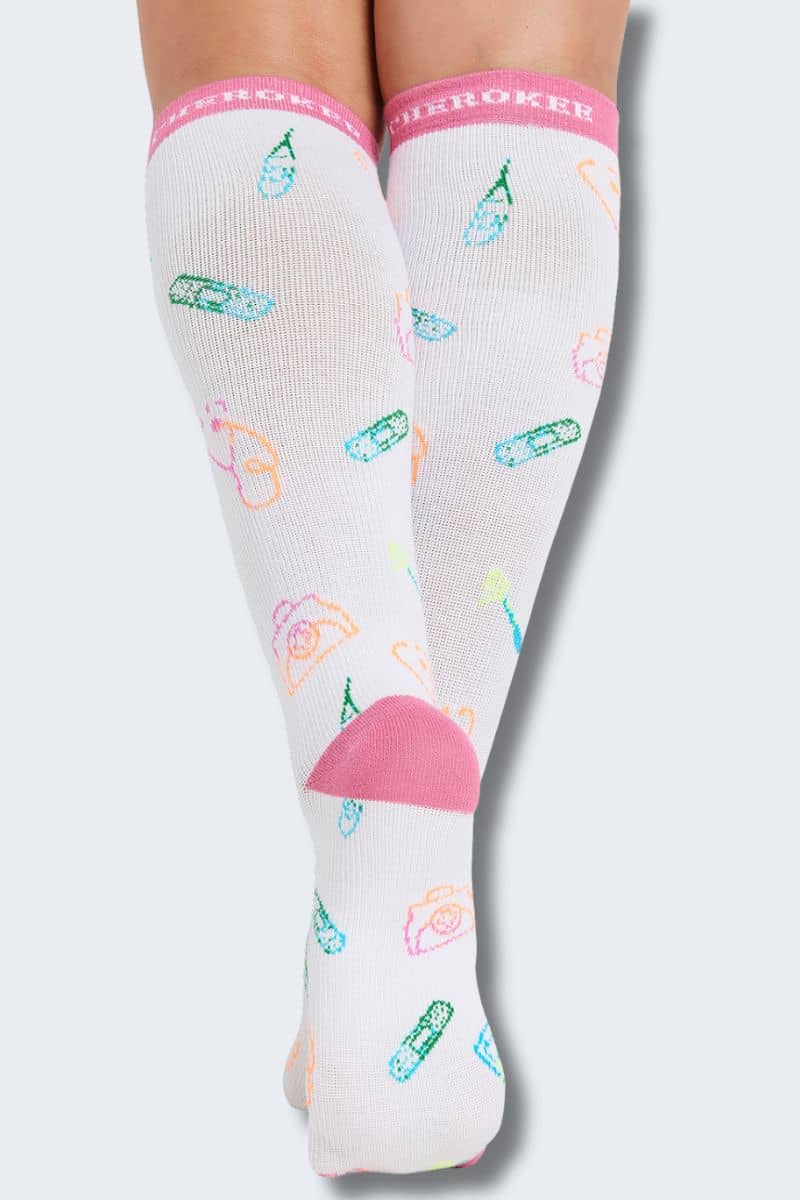 Knee-high socks with colorful pattern and pink accents on a light gray. background. Cherokee Printsupport socks - caring essentials