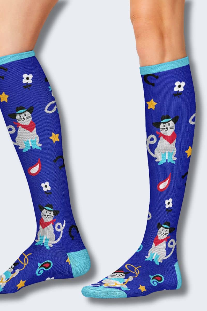 Blue knee-high socks with cartoon dog design on a white background
