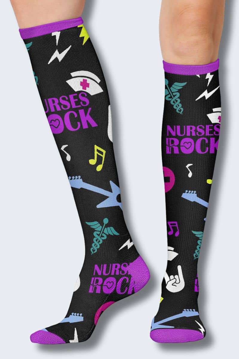 Knee-high socks with 'Nurses Rock' text and musical notes on a black background. PRINTSUPPORT ROCKING NURSES SUPPORT SOCK
