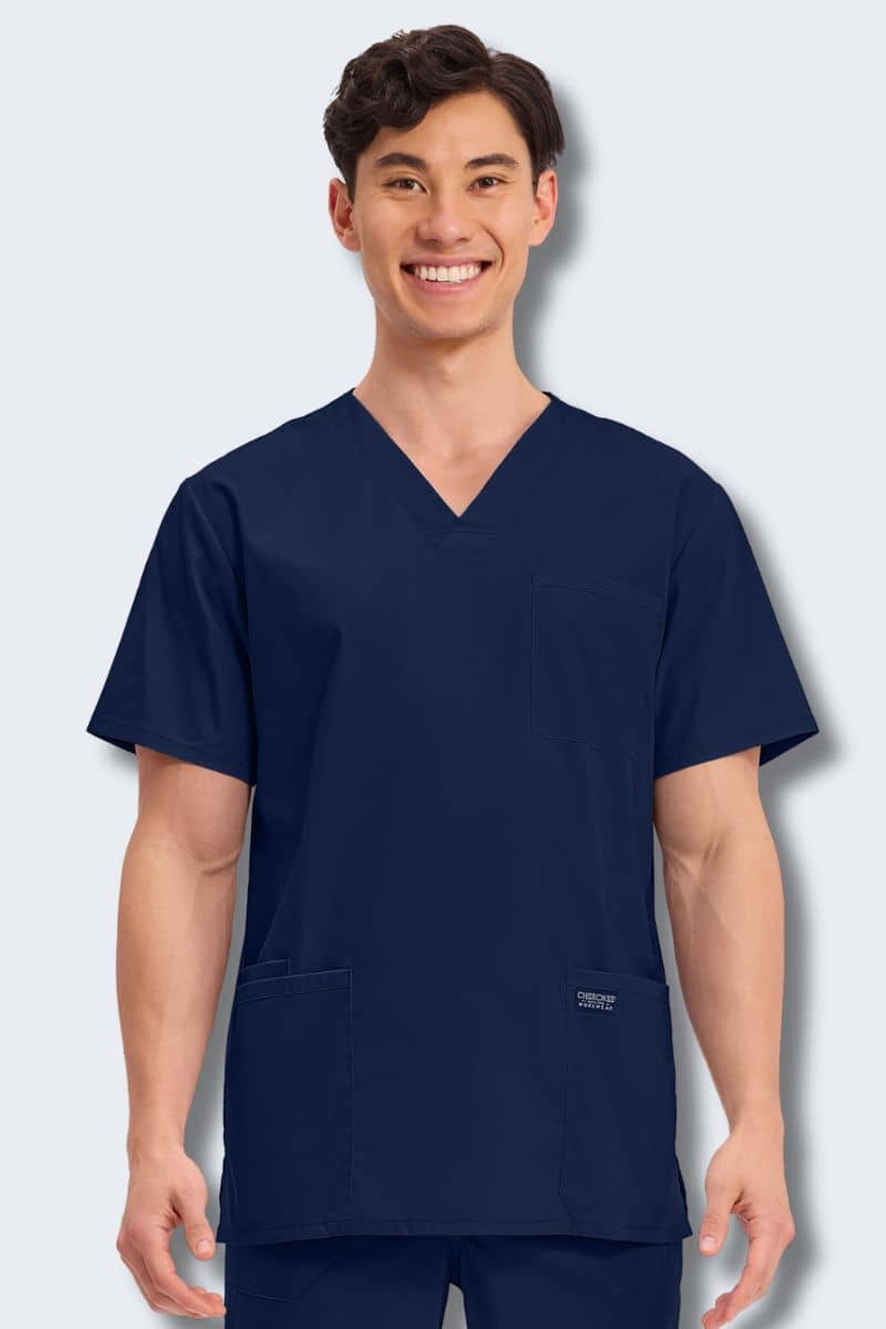 Person wearing a navy blue scrub top on a light gray background. Cherokee WW695_Navy Scrub Top for Men