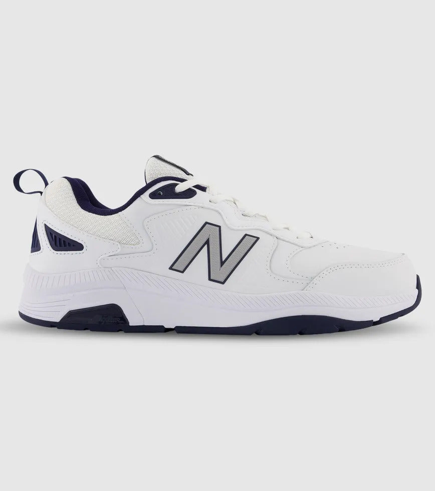 White sneaker with navy accents on a light gray background. MX857wn3 New Balance